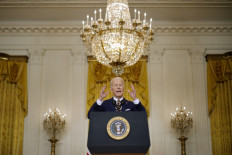 US President Joe Biden takes questions from reporters during a news conference in the East Room of the White House on January 19, 2022 in Washington, DC. With his approval rating hovering around 42 percent, Biden is approaching the end of his first year in the Oval Office with inflation soaring, COVID-19 raging and his legislative agenda stalled on Capitol Hill. 