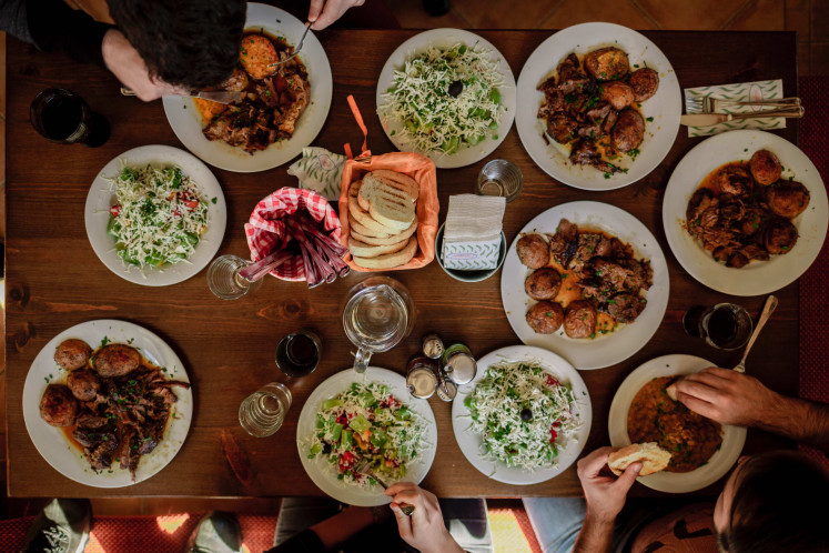 Big meal: (Illustration) Arisan with friends or relatives gives everyone a chance to enjoy a satisfying meal together. (Unsplash/Courtesy of Stefan Vladimirov)