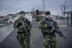Soldiers from Gotland's regiment patrol in Visby harbor on January 13, 2022. Russia's mobilization at Ukraine's border and the rougher tone between Russia and NATO have led the Swedish defense to increase its visible activities, including on Gotland in eastern Sweden.

