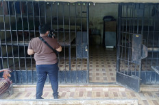 A journalist films one of the iron-barred cells at the house of graft suspect and inactive Langkat regent Terbit Rencana Perangin-Angin in North Sumatra in January.