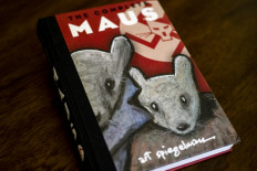 This photo taken in Los Angeles, California on January 27, 2022 shows the cover of the graphic novel 'Maus' by Art Spiegelman.