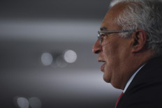 Portuguese incumbent Prime Minister and leader of the Socialist party (PS) Antonio Costa delivers a speech after the announcement of the exit polls at the Socialist Party campaign headquarters on the election night in Lisbon on January 30, 2022. 