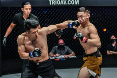 Finisher: Chinese mixed martial artist Zhang Lipeng (left) lands a powerful punch to knock out Ruslan Emilbek Uulu in their lightweight encounter at ONE: ONLY THE BRAVE in Singapore