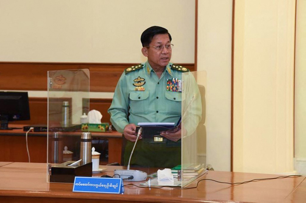 This handout image taken on January 31, 2022 by the Myanmar Military Information Team shows Myanmar junta chief Min Aung Hlaing speaking in the capital Naypyidaw. 