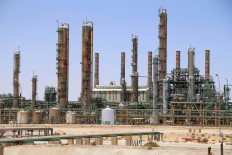 An oil refinery in Libya's northern town of Ras Lanuf is pictured on June 3, 2020. The 23 OPEC+ countries are expected to agree on a modest increase in output at a meeting on Feb. 2, 2022.