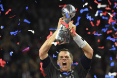  In this file photo taken on February 05, 2017, Tom Brady of the New England Patriots holds the Vince Lombardi Trophy after defeating the Atlanta Falcons 34-28 in overtime during Super Bowl 51 in Houston, Texas. NFL icon Tom Brady confirmed his retirement from the sport on February 1, 2022, officially bringing the curtain down on a glittering 22-season career. The 44-year-old superstar, widely regarded as the greatest quarterback in history, made the announcement in a post on Instagram.