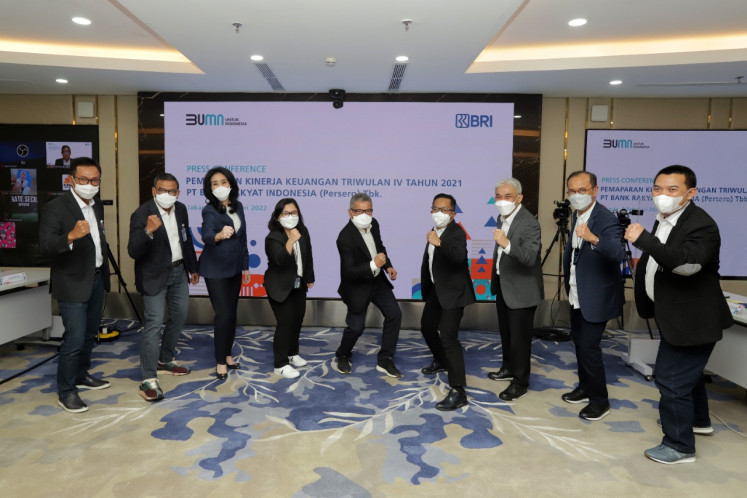 Bank Rakyat Indonesia (BRI) executives pose for a picture on Feb 3, 2022, the day the state-owned lender presented its 2021 earnings report.  