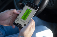 NFT artist: Robness shows his piece Brute Trash Can on his mobile phone on Jan. 27, 2022 at Torrance Beach in Torrance, California. The artwork, listed as a non-fungible token (NFT), sold for more than $250,000.