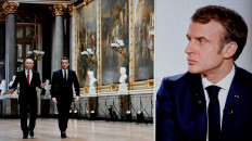 A picture taken on December 15, 2021 shows a television screen broadcasting French TV channel TF1 as French President Emmanuel Macron looks at a picture showing him with Russian President Vladimir Putin during an interview at the Elysee Palace in Paris. 