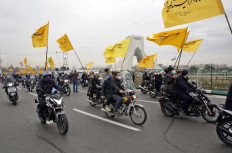 Iranians take part in a rally marking the 43rd anniversary of the 1979 Islamic Revolution, at the Azadi (Freedom) square in Tehran, on February 11, 2022.