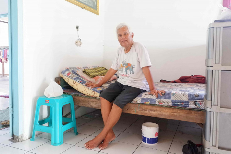 In recovery: Trans woman Edi Romlah, who suffers from diabetes and respiratory problems, is over the moon that she has seen big improvements in her health since living at the WCC’s shelter. (JP/A. Kurniawan Ulung)