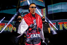 Indonesian mixed martial artist Sunoto walks to the circle at ONE: BAD BLOOD on Friday.