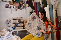 Fashion designer Emma Gage, of Melke, works at her studio ahead of New York Fashion Week on February 4, 2022, in New York City.