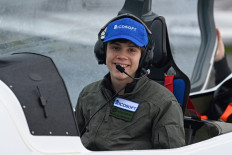 Sky’s the limit: Mack Rutherford poses as he promotes his attempt to be the youngest male to make a round-the-world solo flight, at Biggin Hill Airfield, southeast of London, on Tuesday. The 16-year-old is aiming to fly a Shark ultralight aircraft in the opposite direction to his sister Zara Rutherford, who in January became the youngest female to complete a solo round-the-world flight.