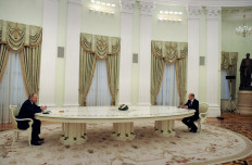 Russian President Vladimir Putin (left) and German Chancellor Olaf Scholz are seen ahead of their meeting over Ukraine security at the Kremlin, in Moscow, on February 15, 2022. The Kremlin earlier confirmed a pullback of some Russian forces from Ukraine's borders but said the move was planned and stressed Russia would continue to move troops across the country as it saw fit.