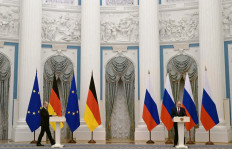 Russian President Vladimir Putin (right) and German Chancellor Olaf Scholz give a joint press conference following their meeting over Ukraine security at the Kremlin, in Moscow, on February 15, 2022. The Kremlin, earlier on February 15, 2022, confirmed a pullback of some Russian forces from Ukraine's borders but said the move was planned and stressed Russia would continue to move troops across the country as it saw fit.