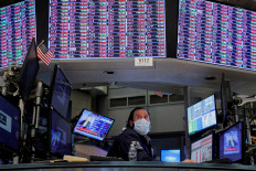 A trader works inside a booth on the floor of the New York Stock Exchange (NYSE) in New York City, US, on Jan. 18, 2022.
