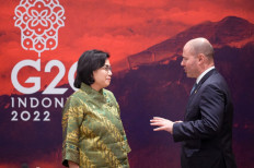 Australian Treasurer Josh Frydenberg (right) chats with Finance Minister Sri Mulyani Indrawati (left) during their bilateral meeting on the sidelines of the G20 finance ministers and central bank governors’ meeting in Jakarta on Feb. 17.