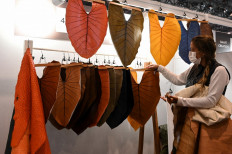 Alternative fabrics: An employee works on a stand at the Premiere Vision Paris, where fashion industry professionals gather to find out which fabrics will dominate coming seasons, at the Parc des Expositions convention center in Villepinte, north of Paris, France, on Feb. 10. 
