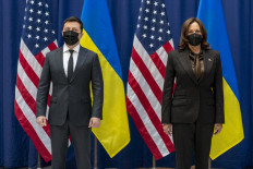 US Vice President Kamala Harris and Ukrainian President Volodymyr Zelensky pose for photographs before a meeting at the Munich Security Conference (MSC) in Munich, southern Germany, on February 19, 2022. During the 58th Munich Security Conference running from February 18-20, 2022, international diplomats and experts meet to discuss topics such as global order, human and transnational security, defense or sustainability.