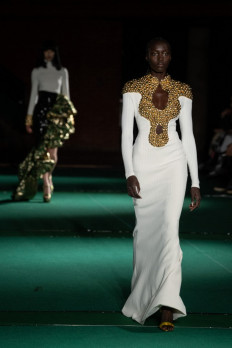 The runway: A model presents a creation from British fashion brand Halpern during the catwalk show for the Fall/Winter 2022 collection on the second day of London Fashion Week in London on Feb. 19.