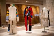 Repurposed ‘luxury’: Clothes designed by British fashion designer Stella McCartney made with waste materials are on display on Feb. 2, 2022 at the “Waste Age: What can design do?” exhibition at the Design Museum in London.