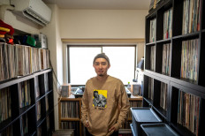 Vinyl nostalgia: Kei Notoya, a DJ who has collected around 3,000 records with music from the City Pop genre, poses for a photo following an interview with AFP at his home studio in the Koganei area of Tokyo.