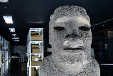 Going home: The Moai Tau, originally from Easter Island, is displayed on Monday at the Chiliean National Museum of Natural History in Santiago. The 715-kilogram monolith, which was taken by the Chilean navy in 1870, will be returned to the self-administered island territory on Feb. 28.