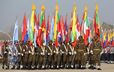 Myanmar junta military soldiers parade during a ceremony to mark the 75th anniversary of the country's Union Day in Naypyidaw on February 12, 2022. 