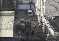 Embassy staff members stand in the courtyard of the Russian Embassy in Kyiv, on February 23, 2022. Moscow's foreign ministry Sergey Lavrov announced on February 23, 2022 it would evacuate diplomats from the country soon, saying this was in order to 