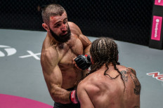 Striking: Kiamrian Abbasov (left) trades punches with James Nakashima in their welterweight encounter in 2020. 