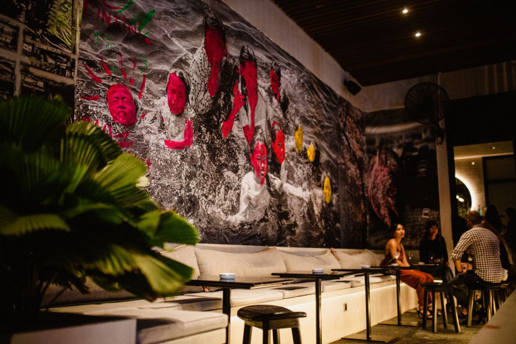 Japanese vibe: Uni Restaurant is filled with Japanese art, with an entire wall displaying Hokusai-like images.  (Uni Restaurant/Courtesy of Uni)