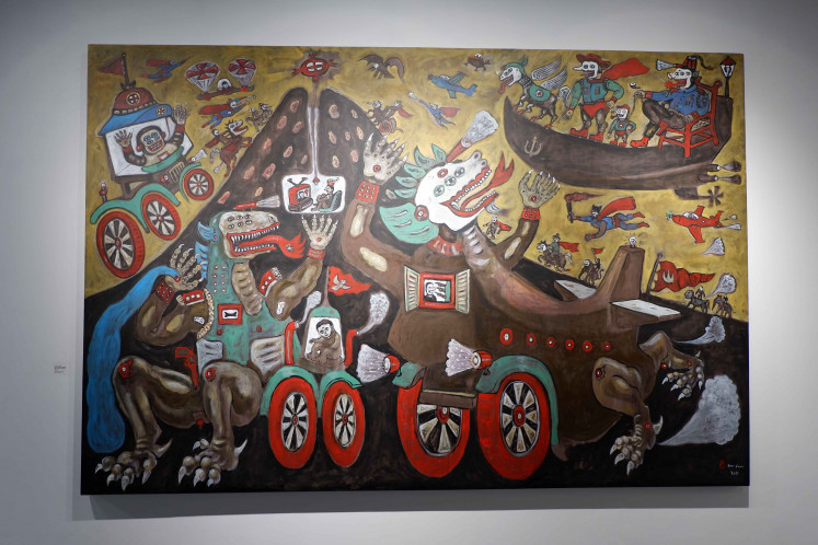Medium of expression: Titled “The Trojan Komodo Met Glass Vehicles”, this painting criticizes global capitalism, which Heri Dono believes has caused environmental issues around the world. (JP/A.Kurniawan Ulung)