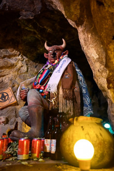 ‘Lord of the Underworld’: An image of El Tio (The Uncle), referring to satan, is appeased during a llama sacrifice ceremony to thank Mother Earth at the Itos tin mine in the outskirts of Oruro, Bolivia, on Friday. 
