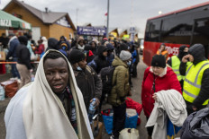 Refugees from many diffrent countries - from Africa, Middle East and India - mostly students of Ukrainian universities are seen at the Medyka pedestrian border crossing fleeing the conflict in Ukraine, in eastern Poland on February 27, 2022. As Ukraine braces for a feared Russian invasion, its EU member neighbours are making preparations for a possible influx of hundreds of thousands or even millions of refugees fleeing military action.