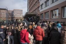 Ukrainian refugees queue to file for residence permits at Prague's foreigner police headquarters on March 2, 2022 in Prague. The Czech Republic has so far welcomed around 20,000 Ukrainian refugees and almost 14,000 had registered with the police in line with the law by Wednesday morning.
