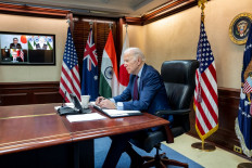 In this image released by The White House, US President Joe Biden virtually meets with Quad leaders about Russia’s ongoing attack on Ukraine, in the White House in Washington, DC, on March 3, 2022 On screen are Japanese Prime Minister Fumio Kishida (top L), Indian Prime Minister Narendra Modi (top R) and Australian Prime Minister Scott Morrison.