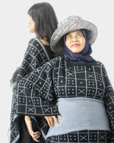 Camera subjects: Aan Aminah (front) and Diandra Aprillian act as photoshoot models in Widi Asari's performance. (Courtesy of Widi Asari)