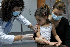 A health worker administers a measles vaccine in a hospital of Montenegro's capital Podgorica on February 16, 2020.