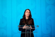 This handout picture taken and released on November 11, 2021 by APEC New Zealand shows New Zealand's Prime Minister Jacinda Ardern (C) speaking during her opening address at the Asia-Pacific Economic Cooperation (APEC) CEO Summit in Wellington. 