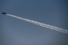 An Indian Air Force fighter jet performs during a re-enactment of the 1947 landings of Indian troops at Srinagar, during a function at the Indian Air-Force base in Srinagar on October 27, 2021. 