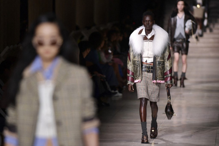 On-schedule: Models present creations for the Miu Miu Fall-Winter 2022-2023 collection fashion show during the Paris Womenswear Fashion Week, in Paris, on March 8.(AFP/Julien De Rosa)