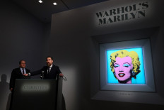 Christie’s Americas chairman Marc Porter (left) looks on as Christie's chairman, 20th and 21st Century Art, Alex Rotter announces that Christie's will offer Andy Warhol’s Shot Sage Blue Marilyn painting of Marilyn Monroe during its May Marquee Week of sales at Christie’s on March 21, 2022 in New York City. The work comes to Christie’s from the Thomas and Doris Ammann Foundation Zurich and all proceeds of the sale will benefit the foundation. 