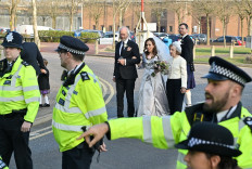 Wedded bliss: John Shipton (center left), the father of WikiLeaks founder Julian Assange, walks with his son's bride Stella Moris (center) as they leave Belmarsh Prison in London, where Assange and Moris were married on Wednesday.