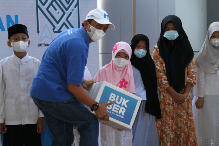 The symbolic act of giving packages to less fortunate kids was the highlight of the main event 