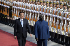Solomon Islands Prime Minister Manasseh Sogavare (right) and Chinese Premier Li Keqiang inspect honour guards during a welcome ceremony at the Great Hall of the People in Beijing on October 9, 2019. 