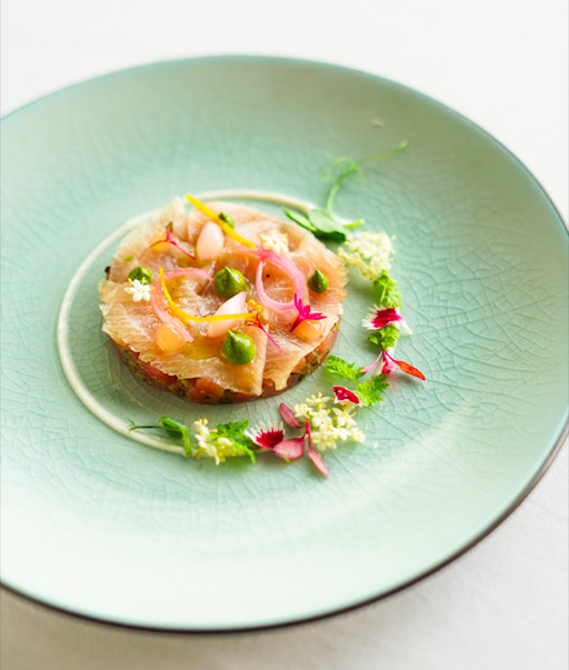 Fruits of the sea: An elegant plating of Gravlax di Tonno e Ricciola features tuna and amberjack and salsa verde with orange and onion 'carpione'. (Courtesy of Four Seasons Hotel Jakarta)