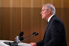 Australia's Prime Minister Scott Morrison speaks to the media to announce sanctions on top Russian officials following the invasion of eastern Ukraine, during a press conference in Sydney on February 23, 2022. 