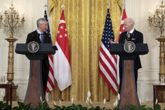 US President Joe Biden delivers remarks alongside Prime Minister Lee Hsien Loong of Singapore in the East Room of the White House on March 29, 2022 in Washington, DC. During their remarks the two leaders discussed the meeting they held earlier in the Oval Office and announced that President Biden would host the Association of Southeast Asian Nations (ASEAN) leaders for a ASEAN-US Special Summit at the White House later in the spring.  