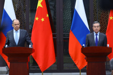 Russian Foreign Minister Sergei Lavrov and Chinese Foreign Minister Wang Yi hold a joint press conference following their talks in Guilin on March 23, 2021. 